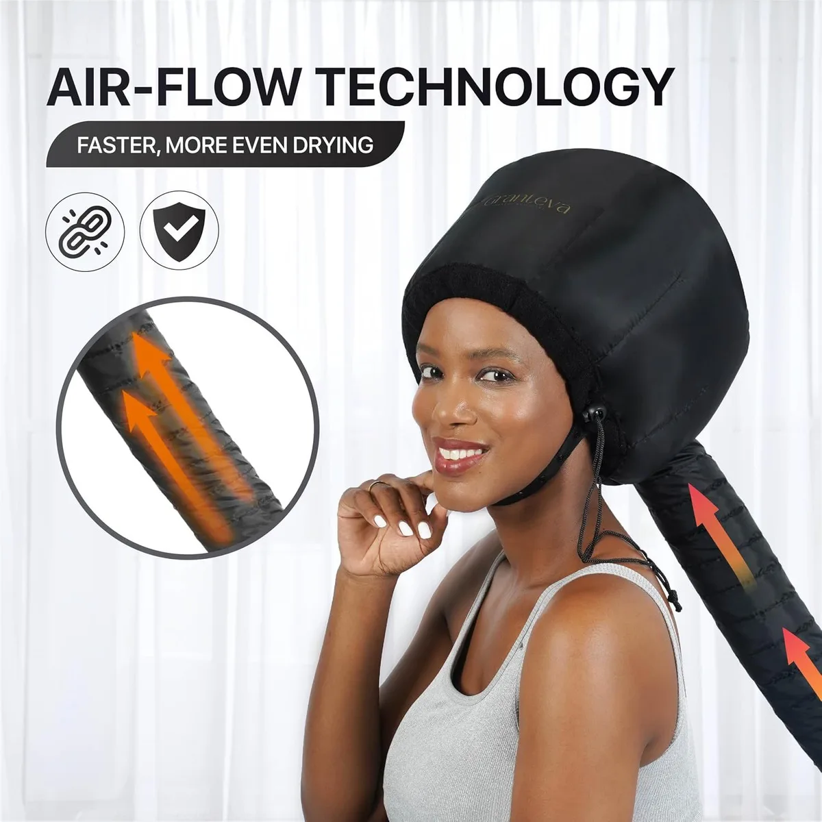 warm air flowing through the hose of the hooded hair dryer attachment