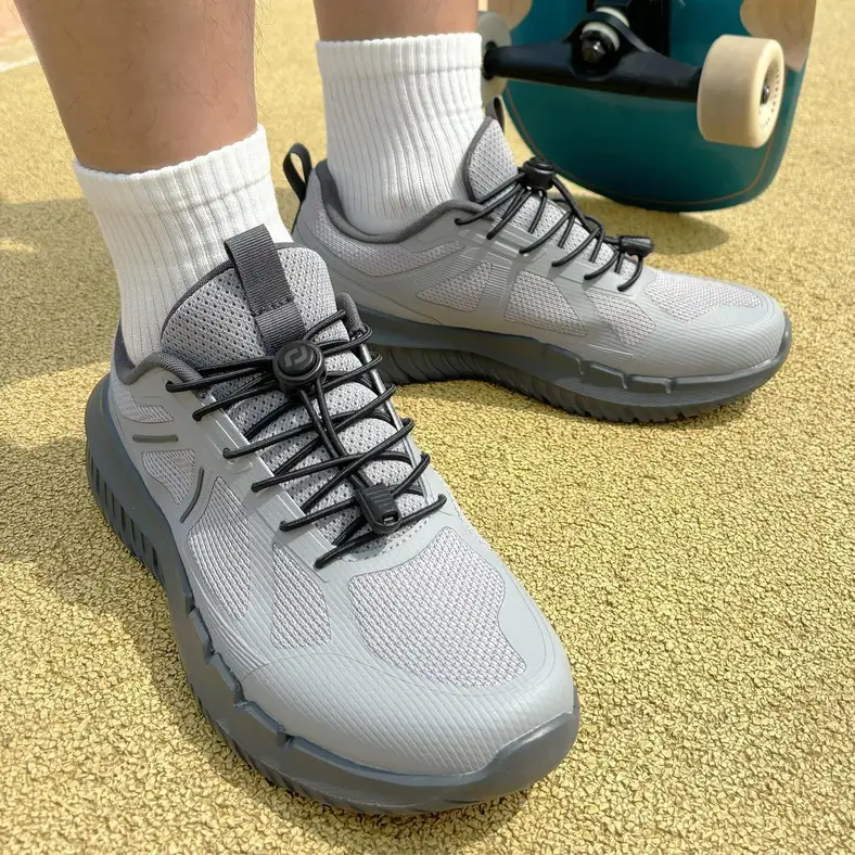black elastic no-tie shoelaces on grey sneakers