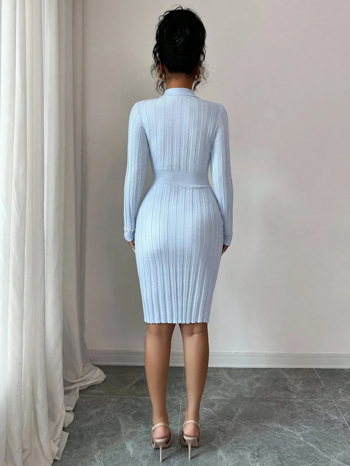 back fit of the long sleeve ribbed knit midi dress