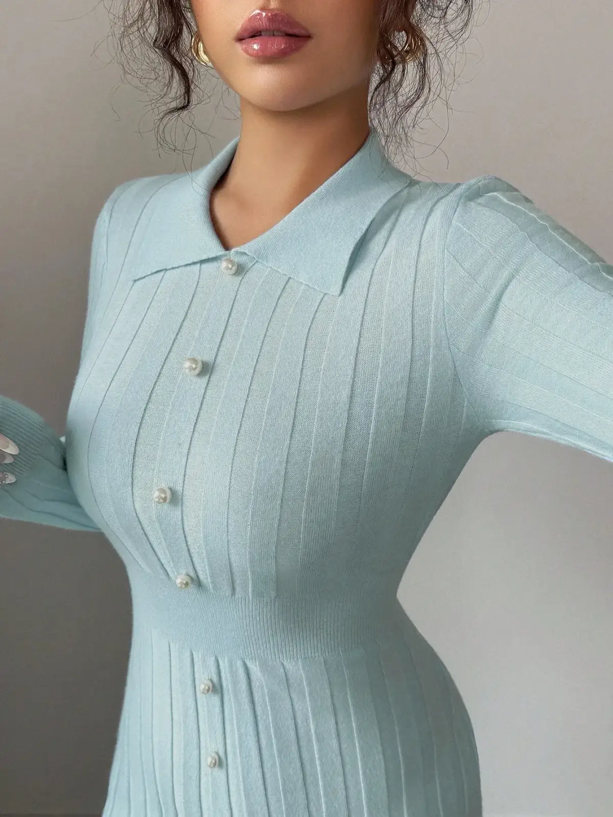 polo collar and pearl button placket of the ribbed knit midi dress