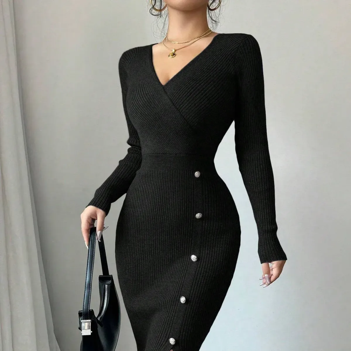 fitted waist and hips of the black wrap V neck knit dress