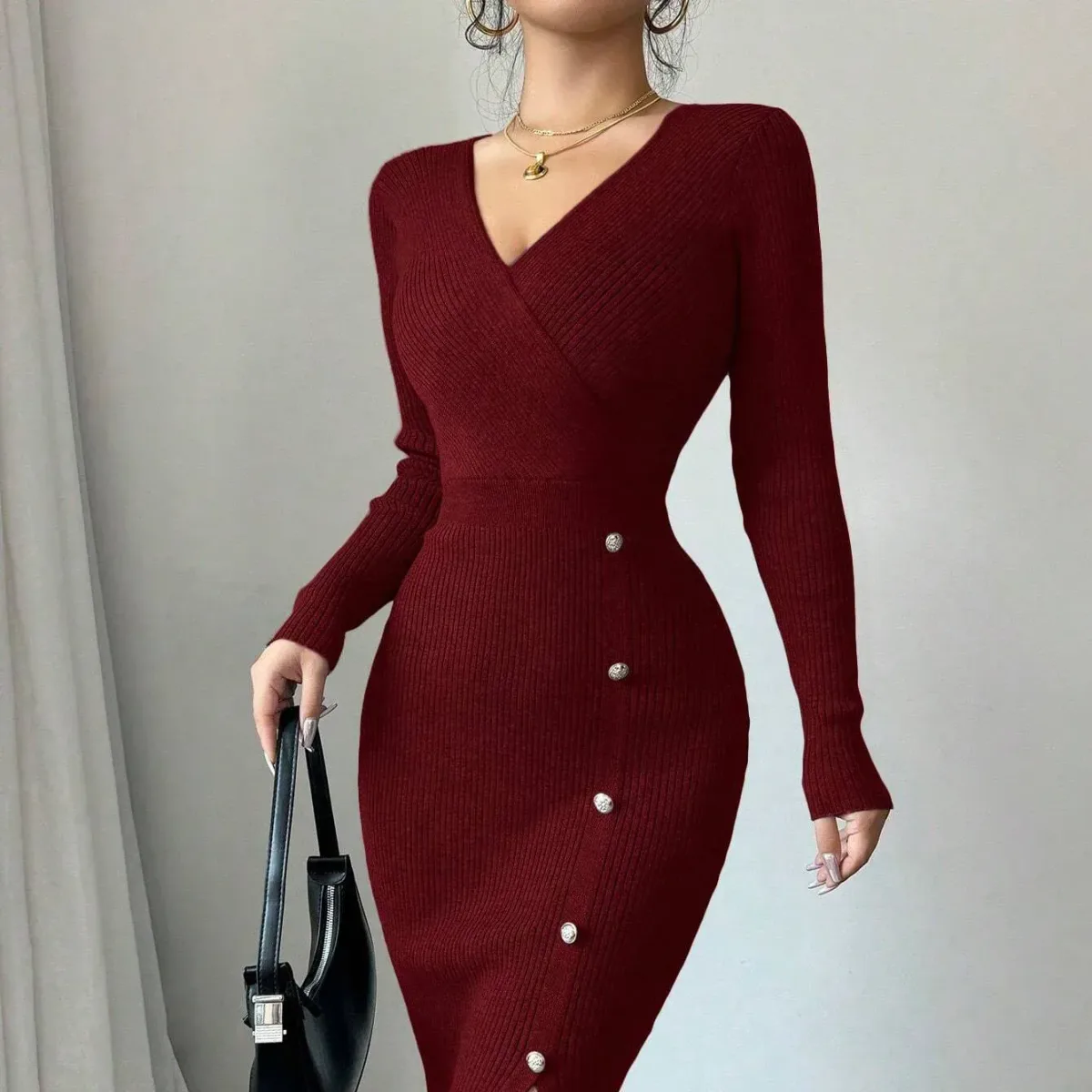 wrap V neckline and fitted waist of the burgundy knit midi dress