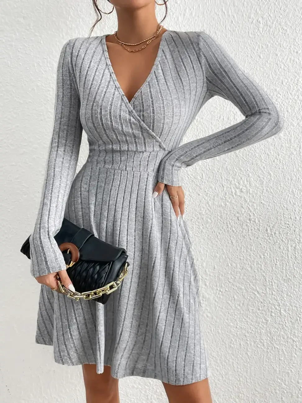 ribbed sweater dress with wrap V neck styled with a black handbag