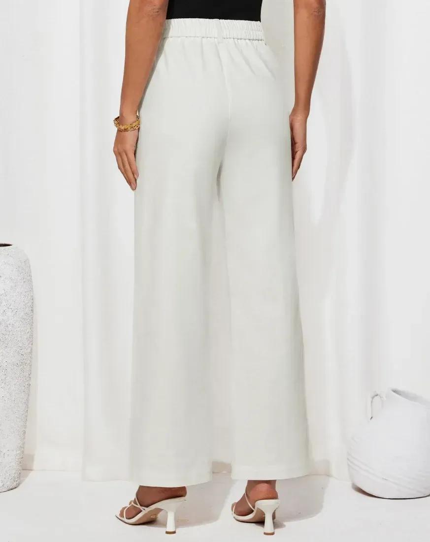 side view of the high waisted straight leg work pants on a model