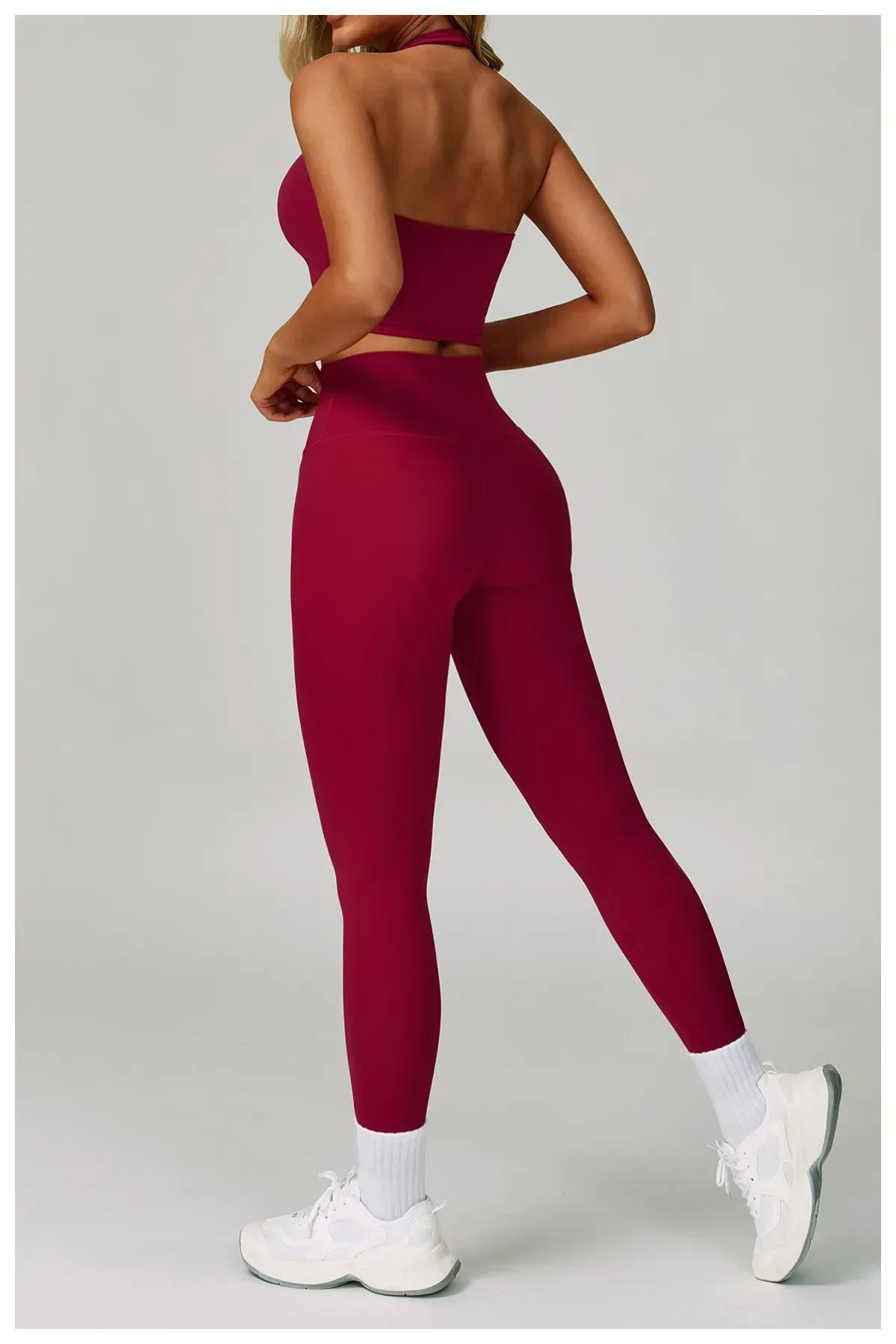 back view of the wine red halter sports bra and leggings activewear set