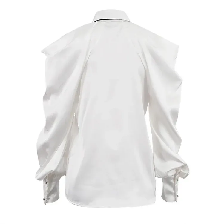 back of the white satin shirt showing sleeve volume and long cuffs