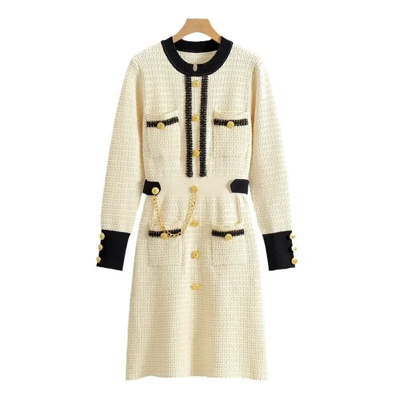 A-line silhouette of the beige knit midi dress on a hanger