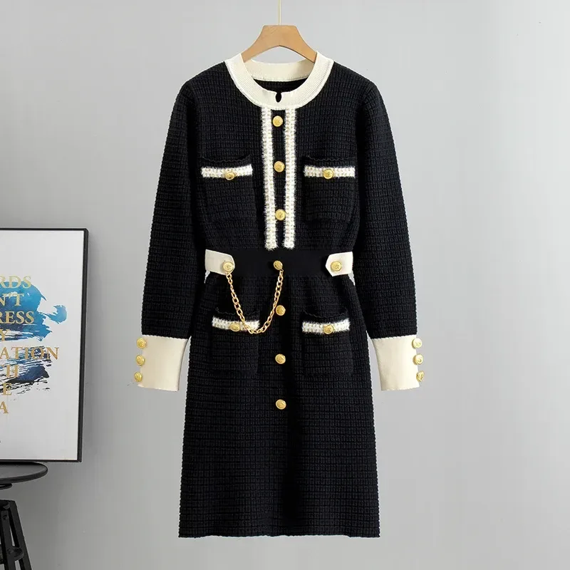 black knit midi dress with beige contrast trim and gold chain