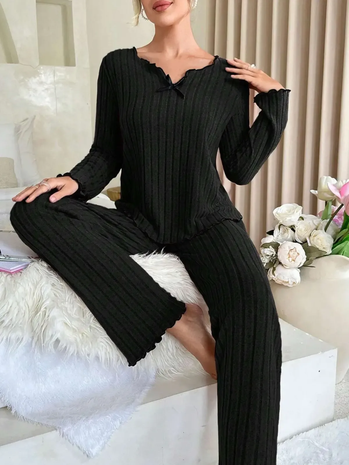 black ribbed loungewear set worn at home