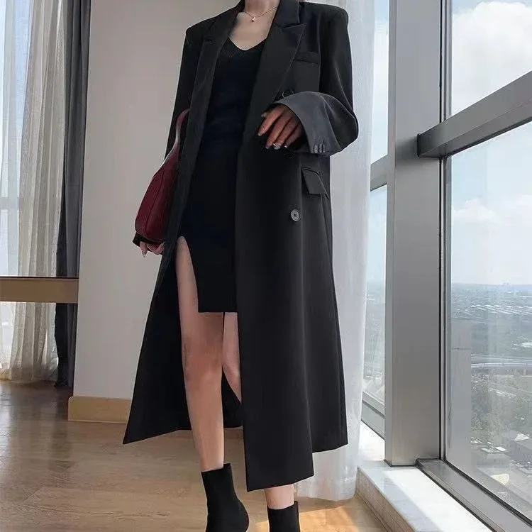 flap pockets on the black long double breasted coat