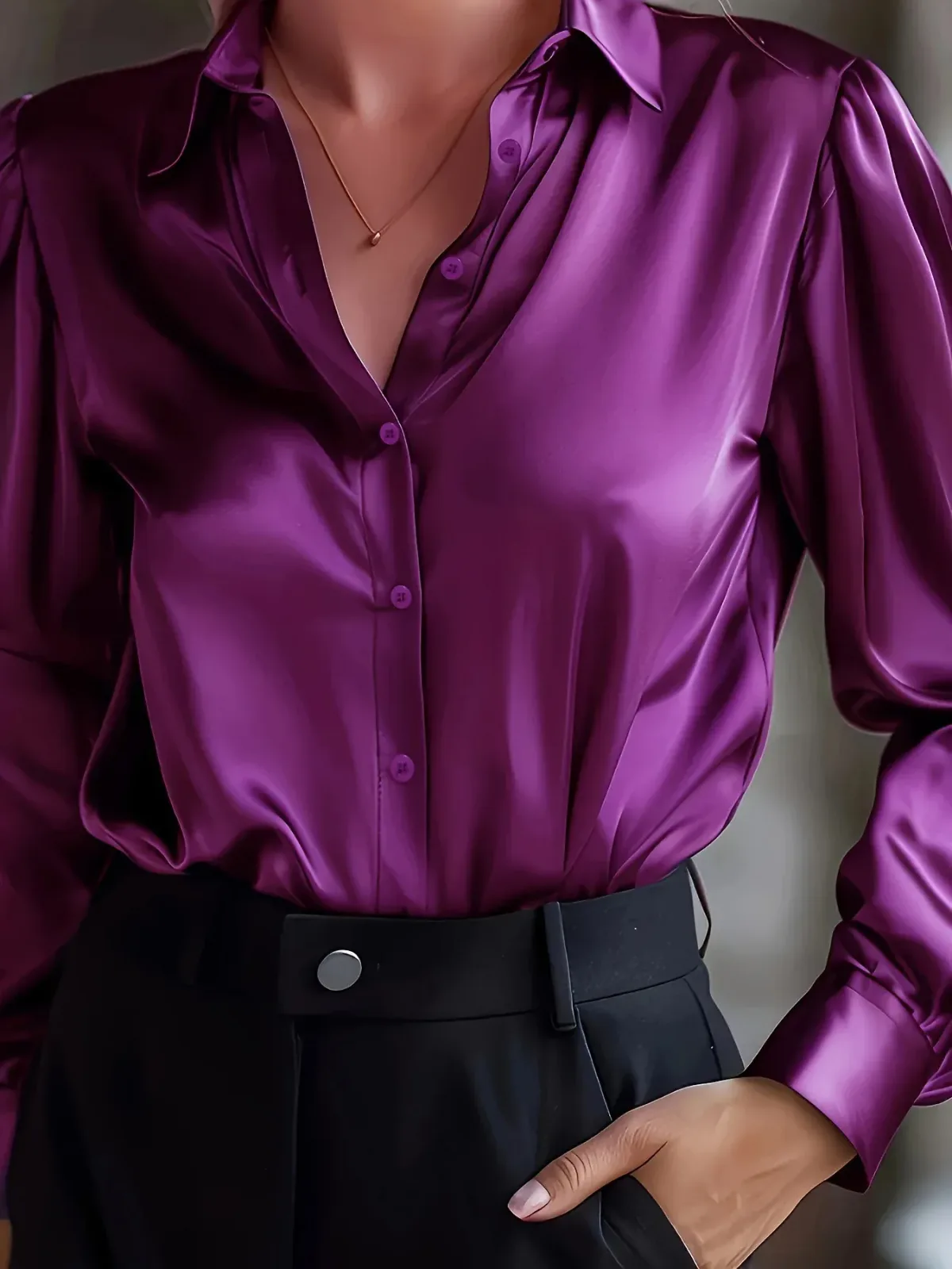 purple silky office shirt worn with black tailored trousers