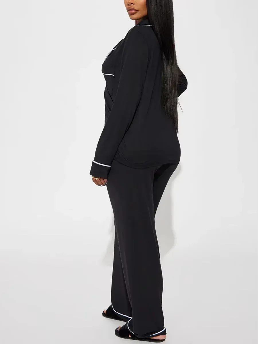 side view of the black soft knit pajama set showing the relaxed straight leg