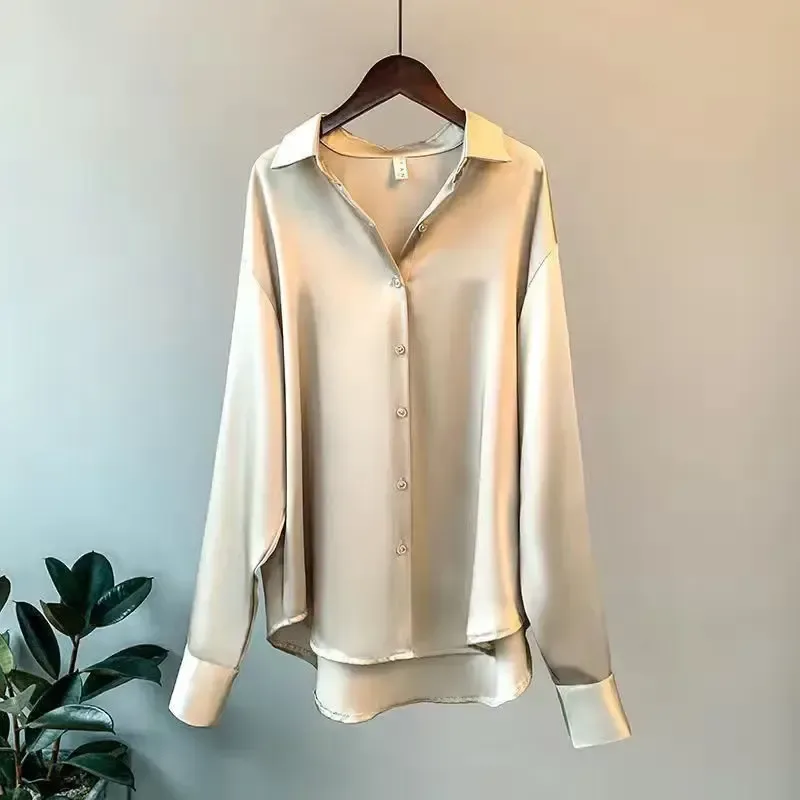 deep buttoned cuffs on the champagne oversized satin shirt