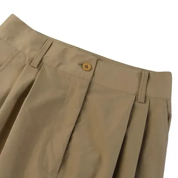 front pleats and button waist detail of the wide leg pants