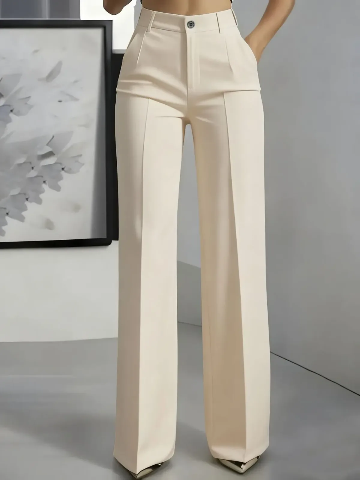 apricot wide leg trousers falling to the floor over heels