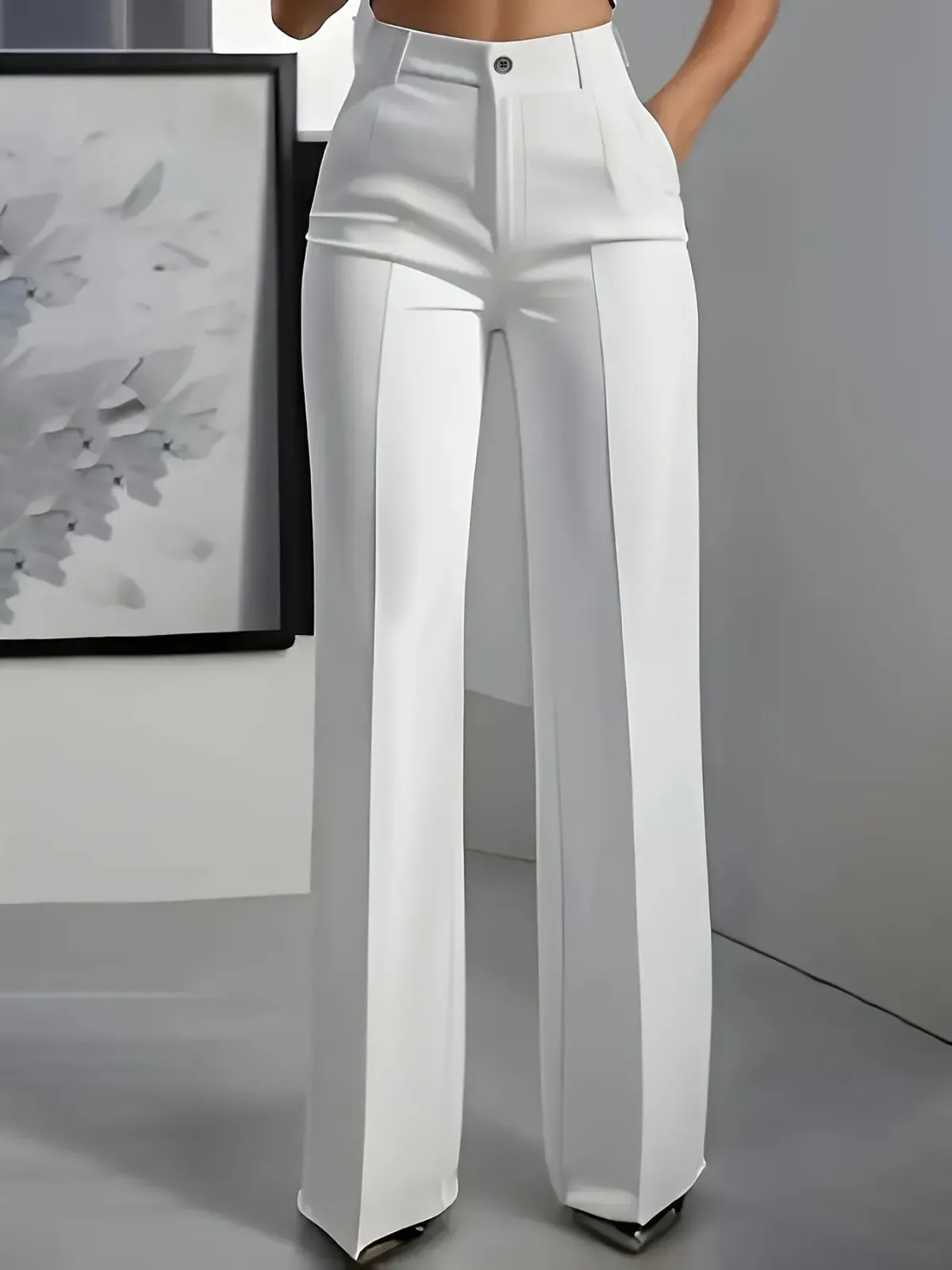 high button waist and side pockets of white wide leg trousers