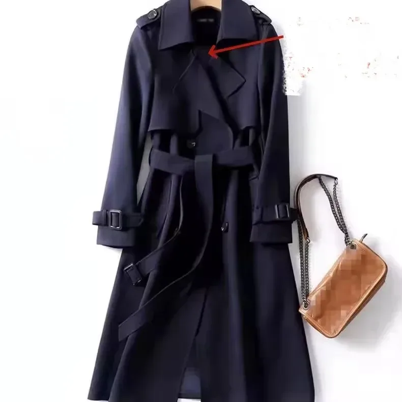 navy long trench coat styled with a shoulder bag