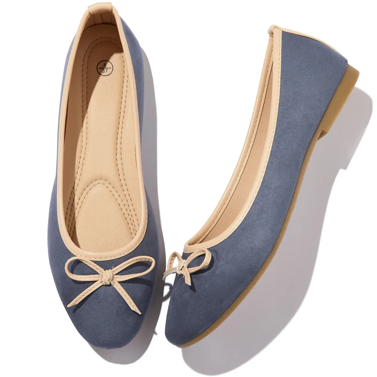 padded insole with arch stitching inside a blue bow ballet flat