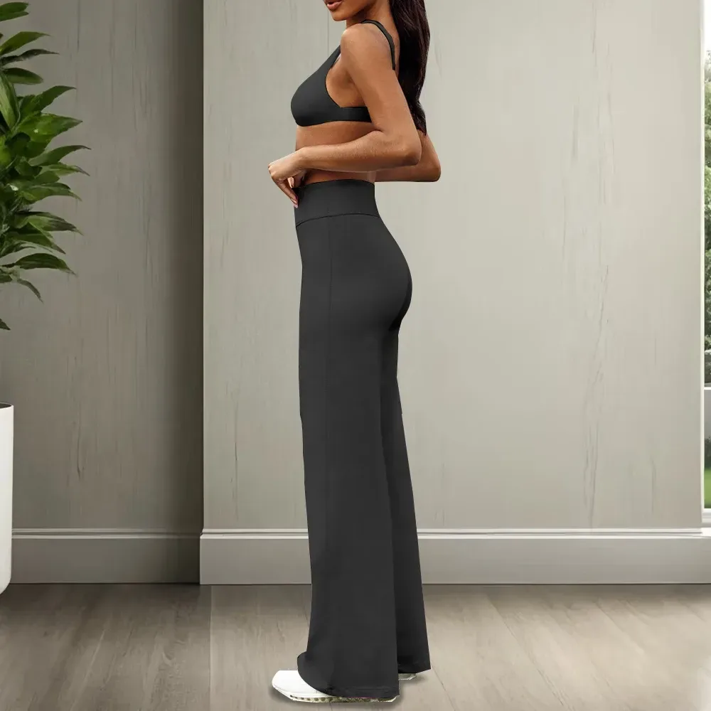 side profile of black high waist stretch flare pants showing the long leg line