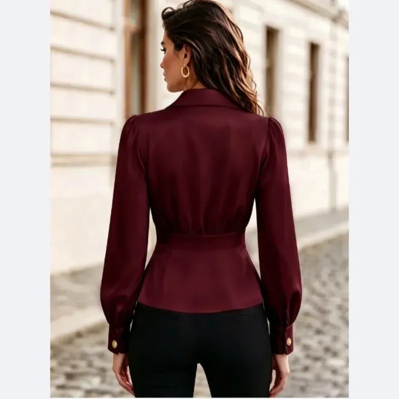 back of a burgundy pleated blouse showing the shaped waist