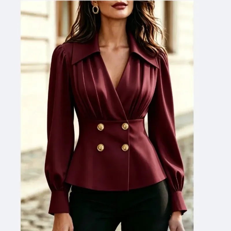burgundy V-neck pleated blouse with gold-tone buttons on the fitted waist