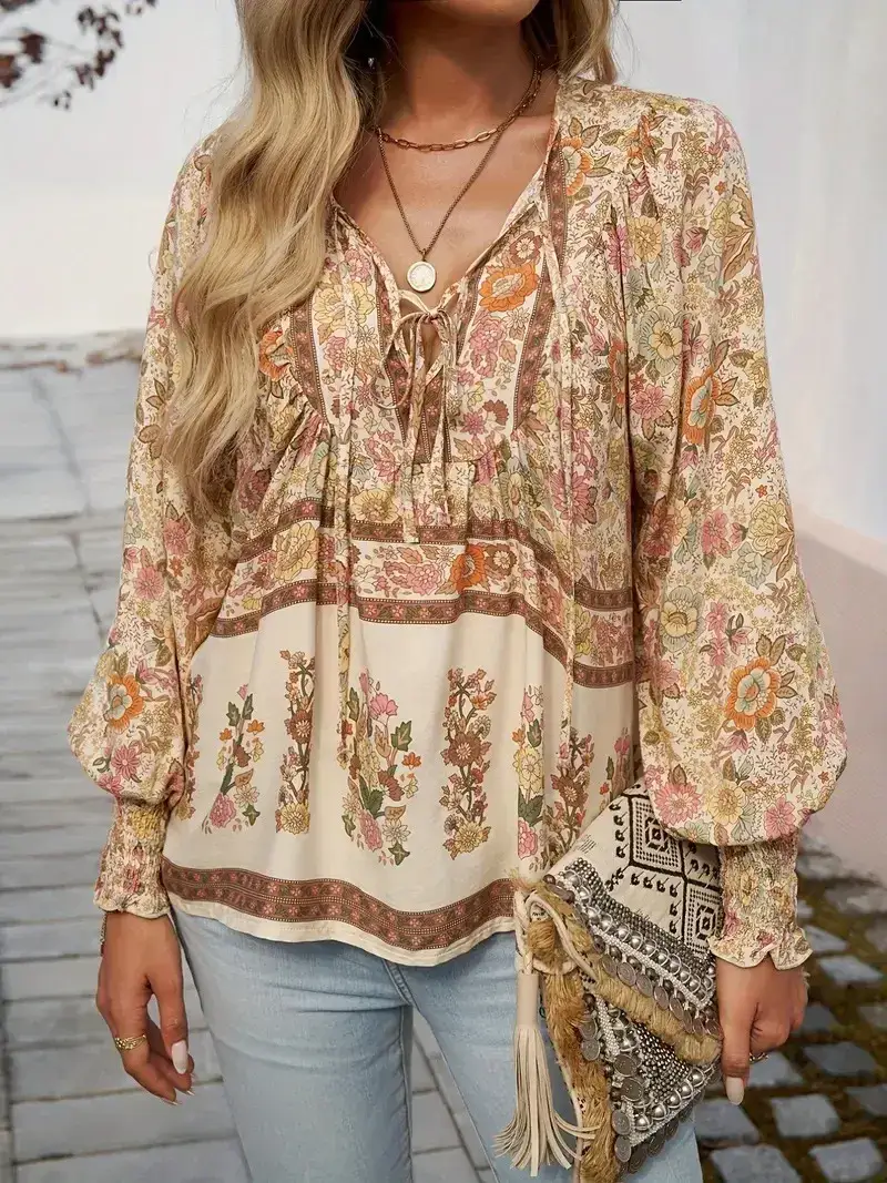khaki boho floral print blouse styled with jeans and a clutch