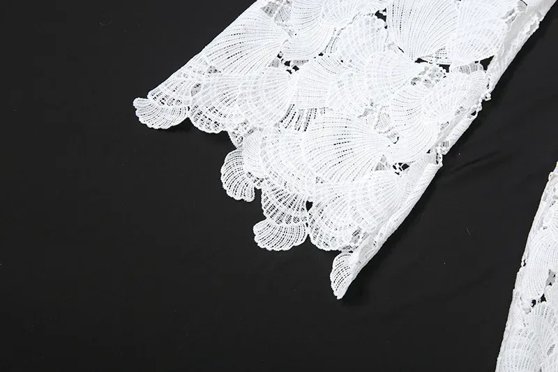 scalloped edge of the lace bell sleeve