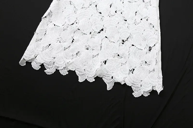 scalloped mermaid hem of the white lace maxi skirt