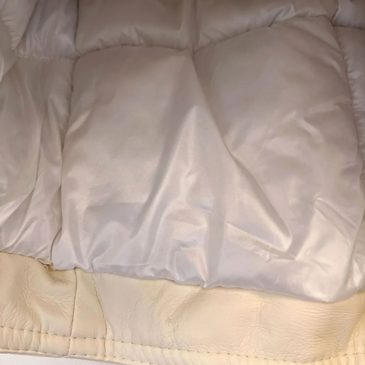 quilted padded lining inside the faux leather winter jacket