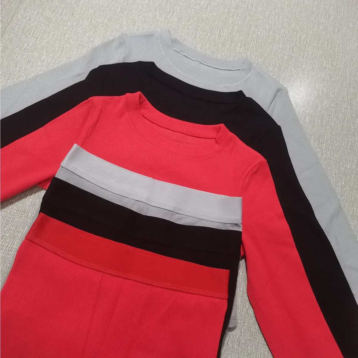 ribbed cotton loungewear set in grey, black and red folded