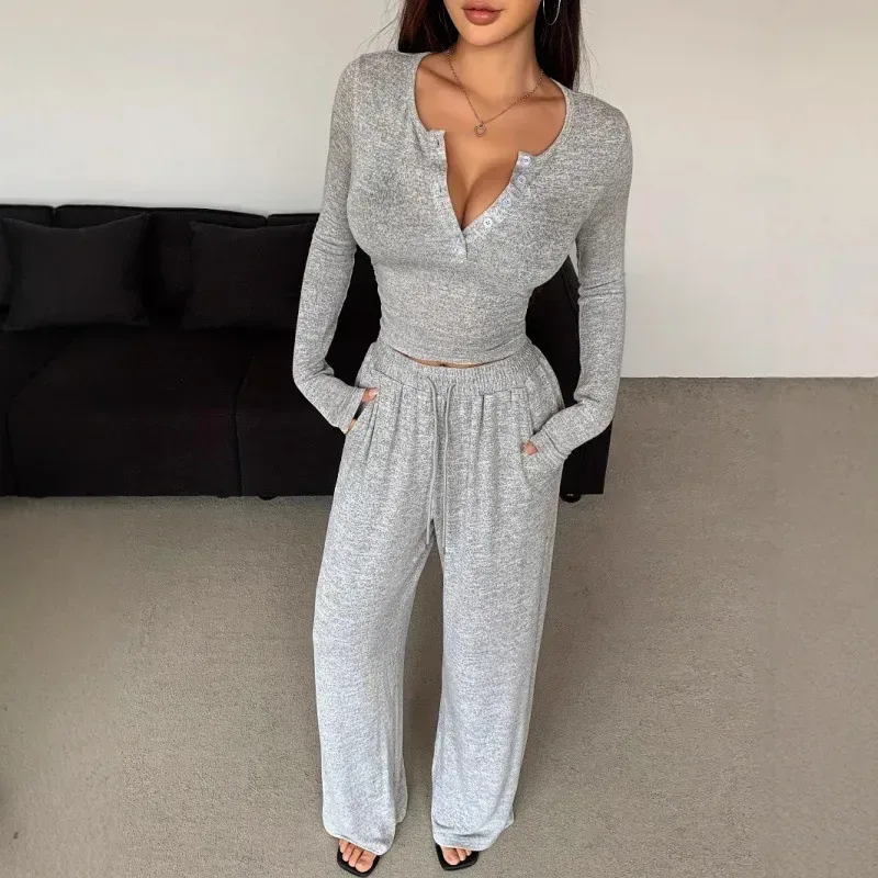 cropped long sleeve henley meeting the high waist of the pants