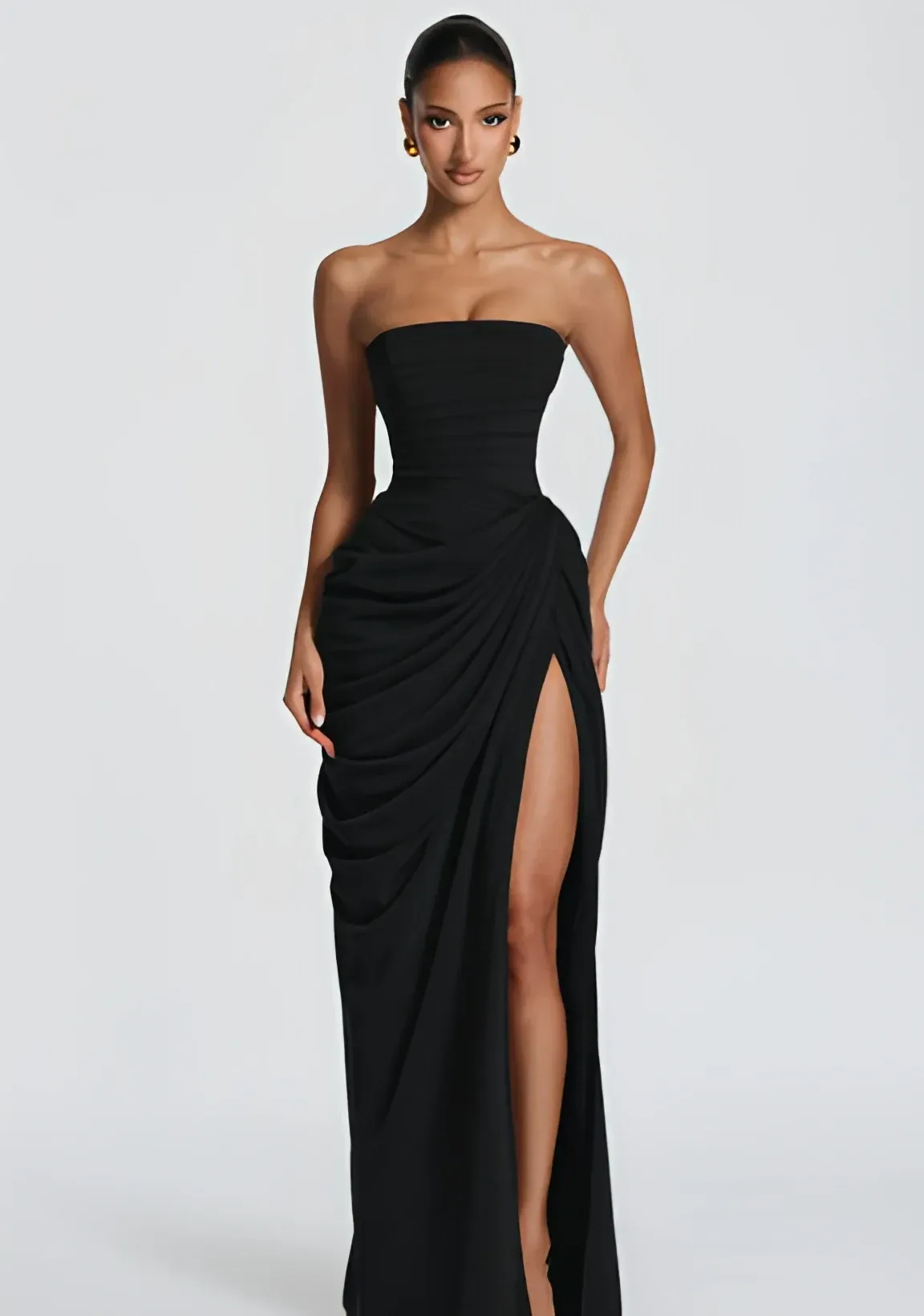 high front slit on the black strapless corset maxi dress