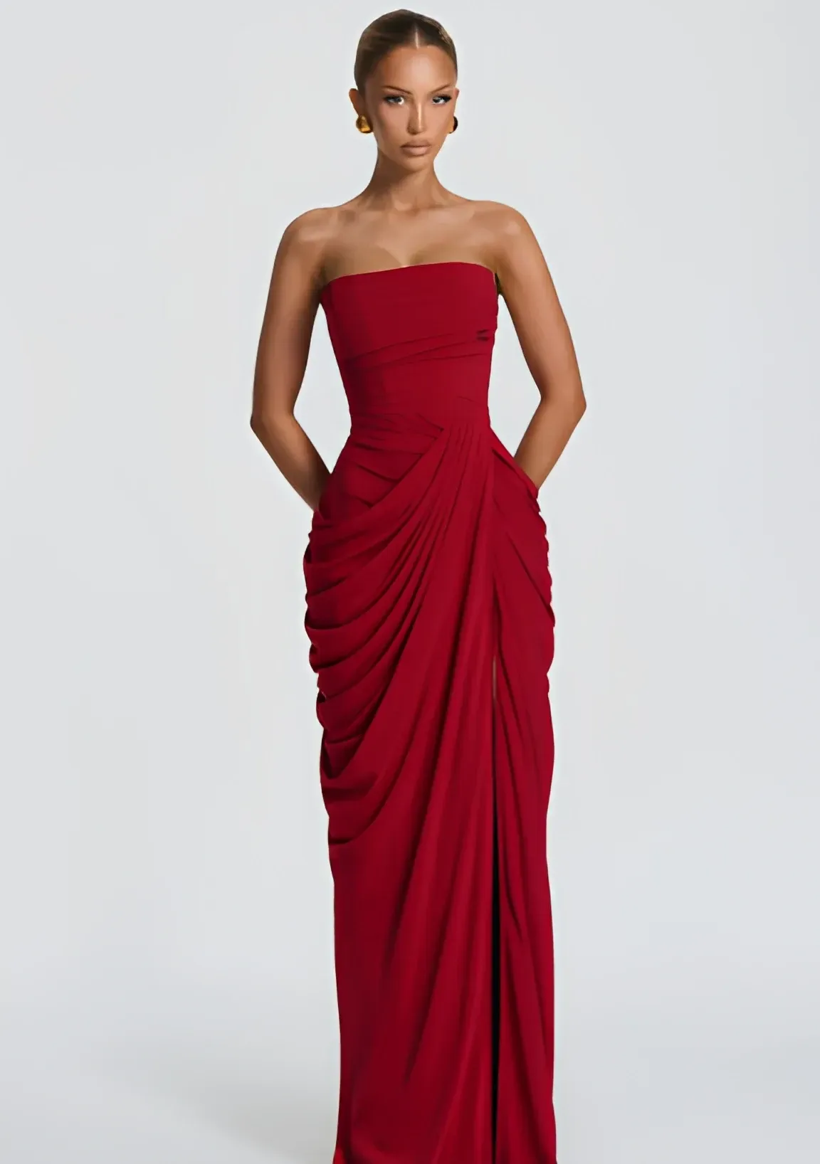 ruched hips on the burgundy strapless corset maxi dress