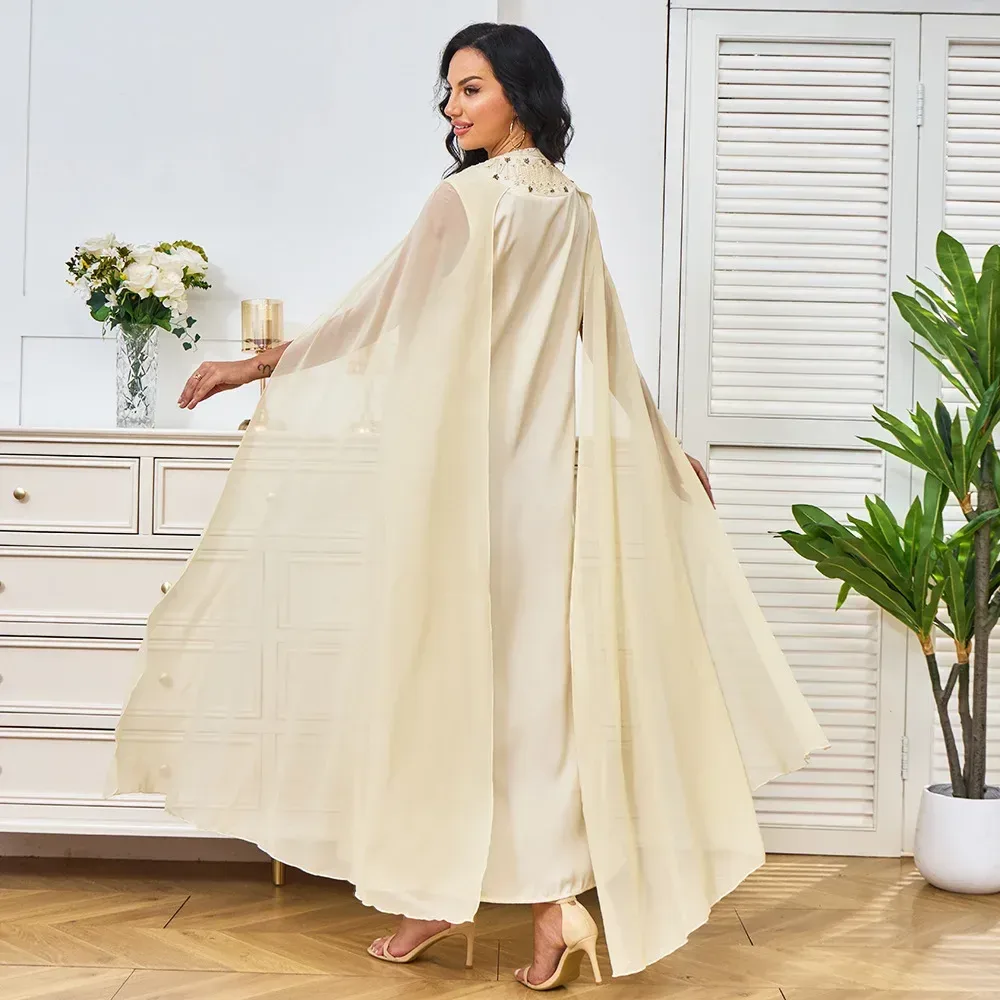 chiffon cape sleeves of the beaded evening maxi dress in motion