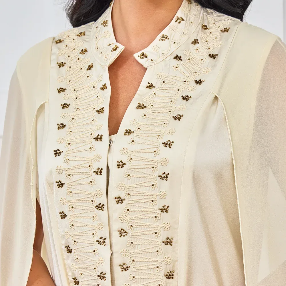 close view of the beading and embroidery on the evening maxi dress