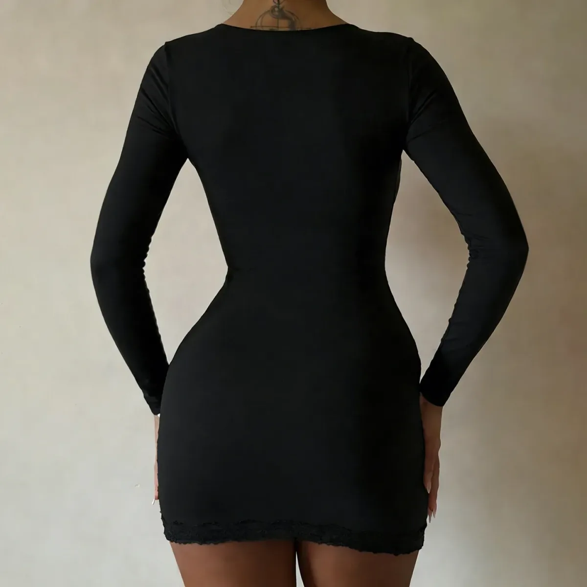 back view of the black square neck long sleeve mini dress