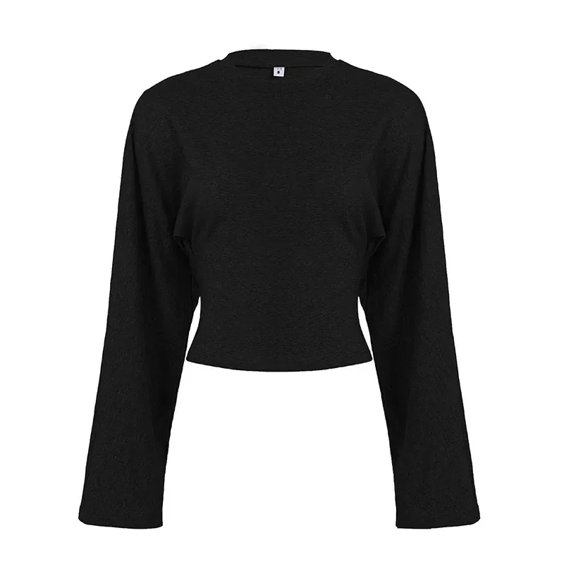 shaped waist seams on the black bell sleeve crop top